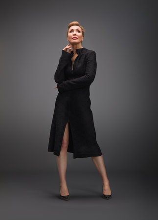 A fashion photoshoot featuring a model in various chic outfits, including leopard print and neutral tones. The images highlight dynamic and expressive poses, showcasing modern and classic styles.の写真素材