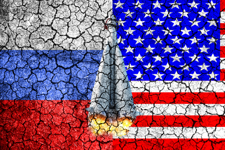 Flag of Russia and USA painted on the cracked wall. Concept of war. Cold war. The arms race. Nuclear war. The third world war. The conflict between Russia and America. Political concept. Front view.の写真素材