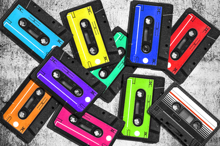 Old audio cassette. Multicolored audio tapes. Close-up view. The concept of old music. The era of retro songs. Isolated objects. large collection of retro cassette tapes. The music of yesteryear.の写真素材