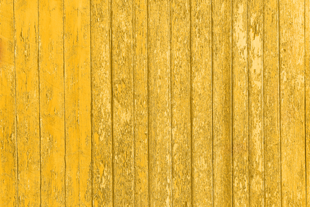Old shabby wooden planks with cracked color paint, background old panels. Color-Peel wood texture. Fracture wall. Ruined floor. The texture of the destroyed wooden wall. Decrepit fence.の写真素材