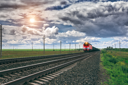 Freight train at railway stationの写真素材