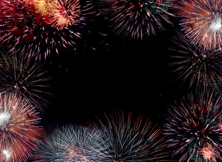 Border (frame) composed of firework flares isolated on black background with empty copy space in the middle to insert some text or images.の写真素材