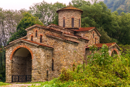 Ancient (X century) christian church made of stones near Arkhyz (Caucasus region) surrounded by a wild nature and mountains.の写真素材