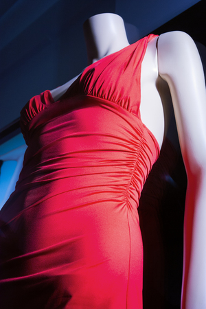 Store window with dressed woman mannequin in shopping mall.の写真素材