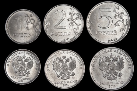 The coins with the emblem of Russia are on a black backgroundの写真素材