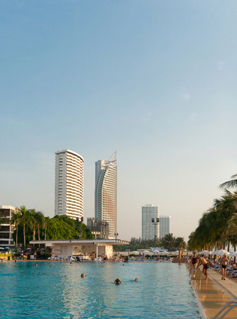 Pattaya, Kingdom of Thailand, December 03, 2018: - People relax by the pool at the Ambassador City Jomtien hotelのeditorial素材