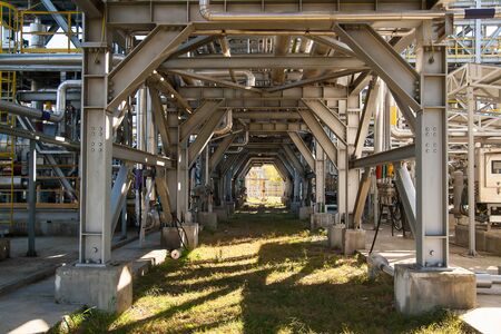 Industrial equipment. Pipeline overpass - bottom view. Metal structures at the factory.の写真素材