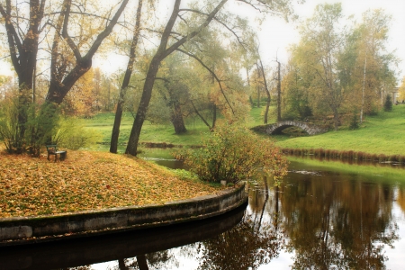 View on river and bridge in the autumn parkの写真素材