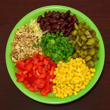 Ingredients for vegetable salad. Green dish. Wooden tableの写真素材