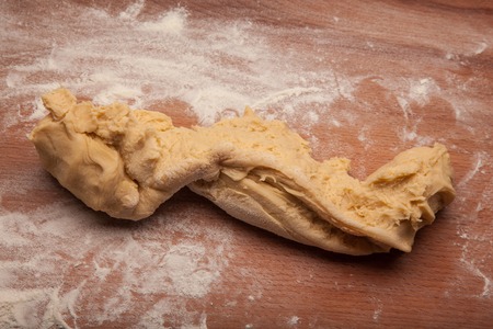 Dough on flour on wooden deskの写真素材