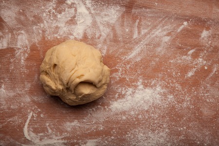 Dough on flour on wooden deskの写真素材
