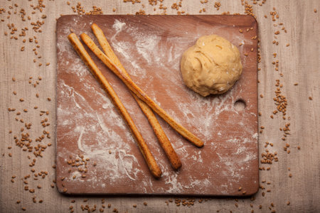 Dough on flour on wooden desk