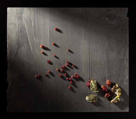 Herb tea ingredients on stone slate plateの写真素材