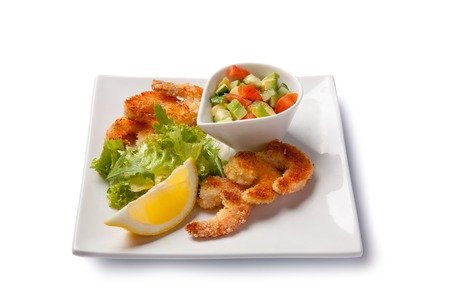 Fried shrimps with vegetables. Isolated on white. High angle viewの写真素材