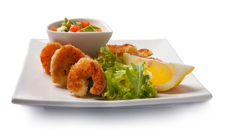 Fried shrimps with vegetables. Isolated on white. Front viewの写真素材