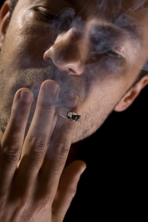 Portrait of a young man smoking a cigarette