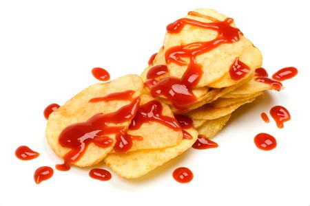 Potato chips with tomato ketchup isolated on whiteの写真素材
