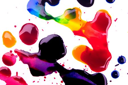 Cyan magenta yellow and black watercolor droplets and spots over white backgroundの写真素材