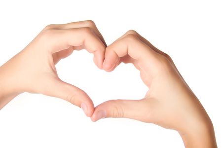 Human hands forming heart shape isolated on white backgroundの写真素材