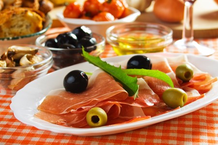 Slices of prosciutto di Parma, italian cured ham served as appetizerの写真素材