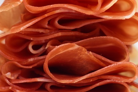 Slices of prosciutto di Parma, traditional italian cured pork meatの写真素材