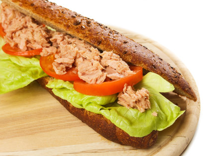 Tuna meat sandwich with lettuce, tomato and green olivesの写真素材