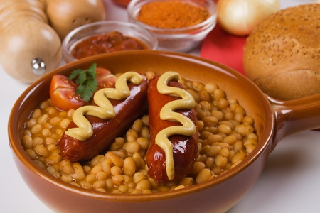 Fried sausage and white beans, traditional european classic mealの写真素材