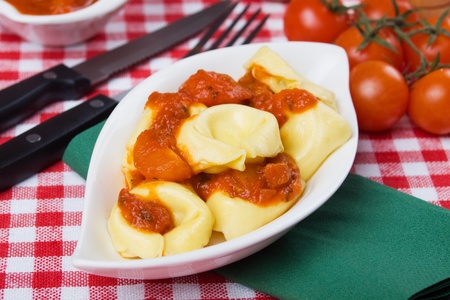 Italian tortellini pasta in basilico and tomato sauceの写真素材