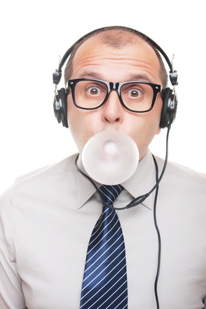 Business man with headphones isolated on white backgroundの写真素材