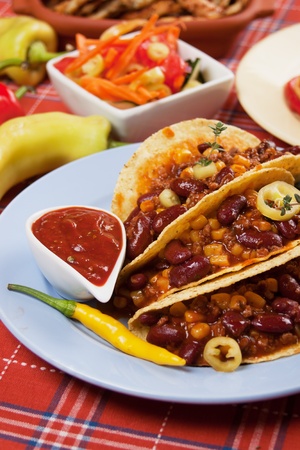 Chili con carne burritos in corn taco shellsの写真素材