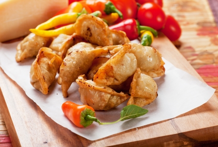 Deep fried asian noodles with hot peppersの写真素材