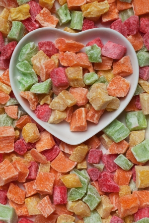 Dried tropical fruit in heart shaped trayの写真素材