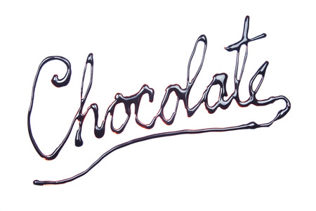 Chocolate word written with topping isolated on white backgroundの写真素材