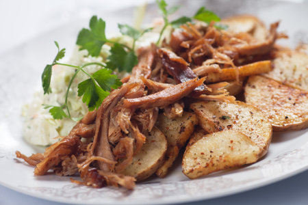 Pulled pork with roasted potato and coleslaw cabbage salad
