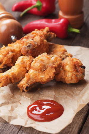 Southern fried chicken wings with barbecue sauceの写真素材