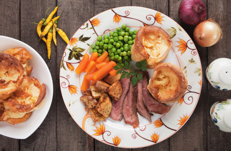 Traditional british sunday roast with yorkshire pudding, roasted potato and vegetablesの写真素材