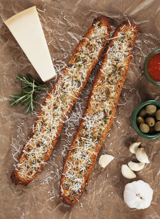 Toasted garlic bread with parmesan cheese and rosemary