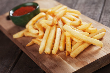 French fries, fried potato sticks served with ketchup