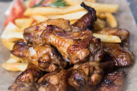 Grilled or oven roasted chicken wings glazed with barbecue sauceの写真素材