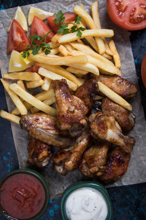 Grilled or oven roasted chicken wings glazed with barbecue sauceの写真素材