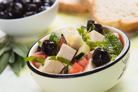 Greek salad with feta cheese cubes and fresk vegetablesの写真素材