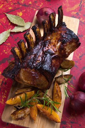 Roasted rack of pork, pork loin roast with frenched ribsの写真素材