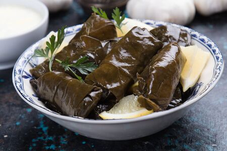 Stuffed grape leaves filled with rice or meat stuffingの写真素材