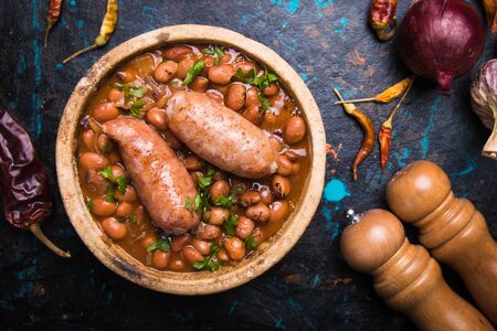 Cooked brown kidney beans stew with pork sausageの写真素材