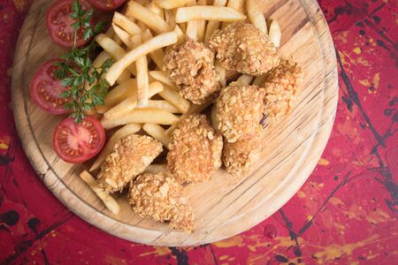 Deep fried and breaded chicken nuggets, american meal served as dinner or fast food mealの写真素材