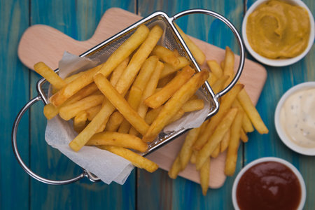 Home made french fries served in frying basket
