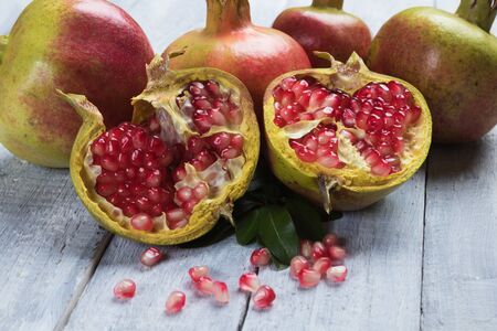Ripe pomegranate, mediterranean fruit opened with red seedsの写真素材