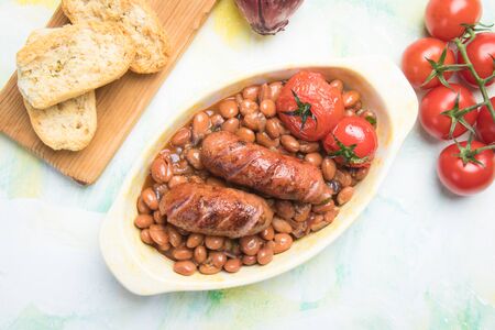 Cooked brown kidney beans stew with pork sausageの写真素材