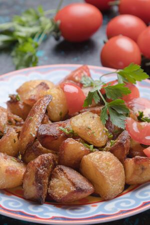 Home made oven roasted potato with herbs and olive oilの写真素材