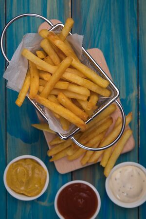 Home made french fries served in frying basketの写真素材